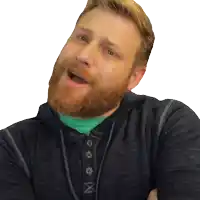a man with a beard is wearing a black shirt with the letter x on the front