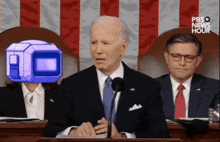 a man in a suit and tie stands in front of a podium that says pbs news hour on it