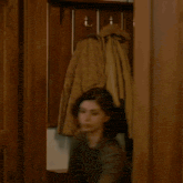 a blurry photo of a woman 's face with her hair blowing in the wind