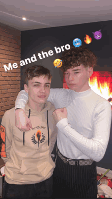 two boys are posing for a picture with the caption " me and the bro "