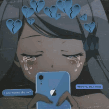 a girl is crying while holding a cell phone with a message that says i just wanna die ok