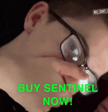 a man wearing glasses is making a funny face with the words buy sentinel now