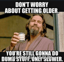 a man in a robe is holding a glass of milk and says " do n't worry about getting older