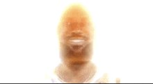 a blurry picture of a man 's face with a white background