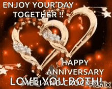 a happy anniversary greeting card with two hearts and the words enjoy your day together