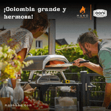 a man and a woman looking at a pizza oven with the words colombia grande y hermosa on the bottom