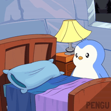 a penguin sits on a bed next to a lamp and nightstand