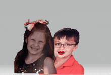 a boy and a girl are posing for a picture and the girl has red lips