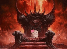 a cat with a pink bow sits on a throne