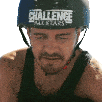 a man wearing a challenge all stars helmet