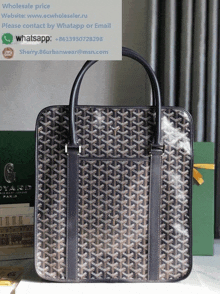 a goyard bag is sitting on a table next to some books