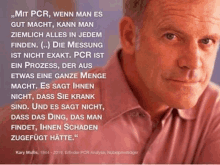 a close up of a man 's face with a quote in german