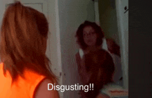 a woman is standing in front of a mirror with the words disgusting written on the bottom