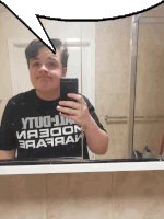 a person taking a selfie in front of a mirror wearing a shirt that says ytuo to ii