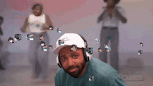 a pixelated image of a man wearing headphones and a hat that says miami