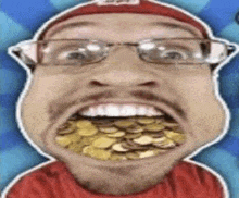 a man with glasses and a beard is eating gold coins .