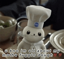 a stuffed animal with a chef 's hat says u kno im all about my motha fugging dough