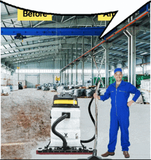 a man in a blue jumpsuit is standing next to a vacuum cleaner in a large warehouse