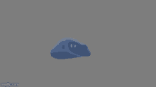 a 3d model of a blue rock with a face on it