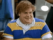 a man in a blue and yellow striped shirt is smiling and says strugglingggg .
