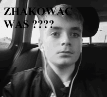 a young man sitting in a car with the words " zhakowac was " written above him