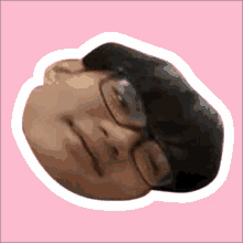 a sticker of a person 's face with glasses on a pink background