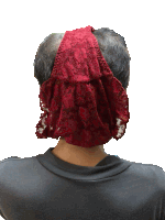 a man wearing a red lace headband covering his face