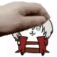 a hand is putting a cartoon character on a wooden shelf .