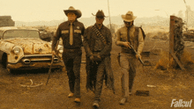 three men in cowboy hats are walking down a dirt road with the word fallout on the bottom