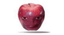 a red apple with a face painted on it .