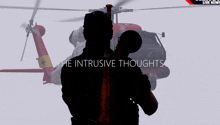 a silhouette of a man standing in front of a helicopter with the words " the intrusive thoughts " below him