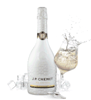a bottle of j.p. chenet next to a glass of it