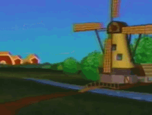 an old dutch windmill is in a field