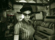 a woman wearing sunglasses and a hat is standing in front of a machine that says ' 00000 ' on it