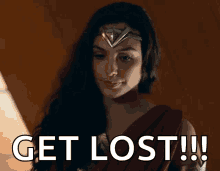 a woman in a wonder woman costume is saying get lost !!!