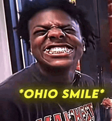 a man with a huge smile on his face is wearing a t-shirt with the word ohio on it .