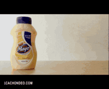 a bottle of mayonnaise is on a table