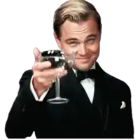 a man in a tuxedo is holding a glass of champagne