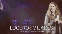 a poster for lucero & mijares shows a man and woman on stage