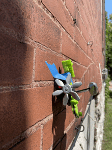 a brick wall with a green sticker on it that says ' a '