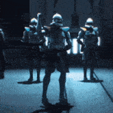 a group of soldiers are standing in a dark room