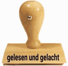 a wooden stamp with the word gelesen and gelacht on it