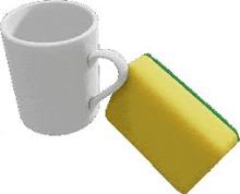 a white mug and a yellow sponge are sitting next to each other on a white background .