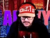 a man wearing headphones and a red hat that says ' dirty ' on it