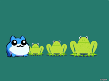 a blue cat standing next to three green frogs