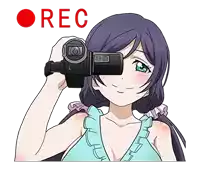 a girl with purple hair is holding a video camera in front of her face and the word rec is above her