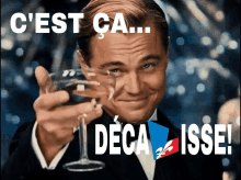 a man in a tuxedo is holding a wine glass with the words c'est ca deca isse written on it