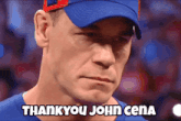 a man wearing a blue shirt and a blue hat says " thank you john cena "