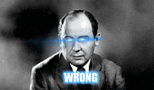 a black and white photo of a man with blue eyes and the word wrong above him