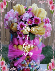 a bouquet of flowers in a vase with the words have a great day written on it